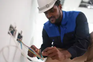 Tradesperson in safety gear working on a job site